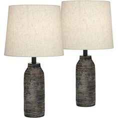 two black and white ceramic lamps with linen shades