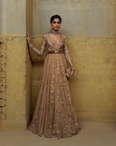 Whether you're attending a glamorous event or a formal celebration, this Sabyasachi inspired gown promises to make a lasting impression. Embrace the allure of the sequin-studded bodice, the richness of metallic zari thread aari work, and the sheer beauty of net fabric, all seamlessly combined to create a gown that transcends trends and stands as a timeless symbol of elegance. Elevate your wardrobe with this enchanting piece that effortlessly blends modern sophistication with traditional craftsma Sabyasachi Gown, Sabyasachi Bridal, Reception Outfit, Reception Gown, Cocktail Outfit, Indian Dresses Traditional, Traditional Indian Outfits, Indian Gowns, Party Wear Indian Dresses