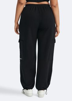 Embrace roomy wide legs and a stretchy fit for ultimate comfort, paired with a flattering high waist for added style. Whether it's grocery runs, lazy Sundays, or a casual hangout, these joggers have you covered in relaxed elegance. Baggy Full-length Athleisure Bottoms, Comfortable Black Relaxed Fit Bottoms, Sporty Leisure Bottoms With Cargo Pockets, Stretch Sweatpants With Cargo Pockets For Loungewear, Full Length Baggy Athleisure Bottoms, Stretch Cargo Sweatpants For Loungewear, Athleisure Full-length Baggy Bottoms, Relaxed Fit Full-length Athleisure Cargo Pants, Baggy Workout Sweatpants