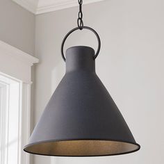 a gray light hanging from a ceiling in a room