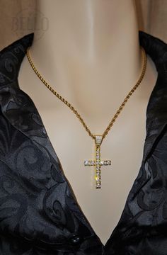 Embrace your faith with our Sparkling Cross Pendant Necklace. This elegant pendant features a beautifully crafted cross adorned with sparkling stones, symbolizing hope and devotion. Pendant Material: 925 Sterling Silver Gold Finish Chain Material: Stainless Steel Design: Detailed cross with sparkling stones Features: Hypoallergenic, suitable for sensitive skin Perfect For: Daily wear, religious events, special occasions, or as a thoughtful gift This Sparkling Cross Pendant Necklace is a timeless Cubic Zirconia Cross Jewelry With Adjustable Chain, Gold Bling Cross Pendant Necklace, Gold Cross Pendant Necklace With Bling, Gold Bling Cross Necklace, Gold Cross Rope Chain Jewelry, Spiritual Diamond-cut Cross Jewelry, Gold Rope Chain Cross Jewelry, Spiritual Cross Jewelry With Diamond Cut, Spiritual Diamond Cut Cross Jewelry