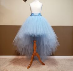 "I CAN MAKE THIS TUTU IN ANY COLOR AND SIZE, PLEASE NOTE THE EXACT TULLE AND RIBBON COLOR AT CHECK OUT (Without note I will make it same color with 1st list photo). 1ST PHOTO TUTU LENGTH FRONT 16'' ABOVE THE KNEE LENGTH, BACK 48'' FLOOR LENGTH, FOR HEIGHT AROUND 5'7'' wear a couple inches of heels . This tutu is made with 250-500 yards of 6'' wide fine tulle so it's super full. Stretchy waist along with a big ribbon bow ties on the waist. (I might use 2''or 1.5'' ribbon depends on which one is in stock.) Sew in lining, the tulle will stay nice and not see through. List photo black tutu front is 16'' above the knee length, back is 44'' full length. Layered cut. The rest photos are fairy angled cut. You will love your tutu once you put it on! TAKING MEASUREMENTS: WAIST: measure your waist wh Fitted Tulle Tutu Dress For Bridesmaids, Fitted Tulle Tutu Bridesmaid Dress, Fitted Blue Tutu Dress For Wedding, Fitted Tulle Tutu Dress For Prom, Fitted Blue Tutu Dress For Pageant, Blue Tulle Tutu Dress For Pageant, Fitted Tulle Tutu Dress For Wedding, Wedding Tutu Dress With Fitted Tulle, Wedding Tulle Fitted Tutu Dress