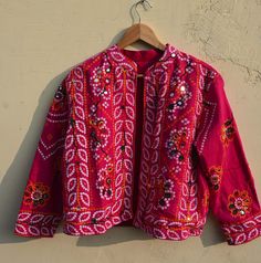 Indian Ethnic Jacket Embroidered Vintage stylish designer jacket for women  This is made of cotton fabric with some unique stylish embroidery and printed. A unique combination embroidery. This jacket is perfect for every traditional functions or parties this gives you a very attractive look. Size : L Length : 21 Inches Chest : 40 Inches Sleeve Length : 20 Inches Free Worldwide Shipping IMP NOTE: The colour of Picture shown above may slightly vary due to flash light, Screen and camera-resolution. Pink Bohemian Outerwear For Festival, Pink Festival Outerwear, Folk Style Patchwork Outerwear For Festivals, Traditional Pink Cotton Outerwear, Festive Outerwear With Handwork, Festive Traditional Outerwear With Mirror Work, Traditional Long Sleeve Choli With Mirror Work, Bollywood Style Long Sleeve Nehru Jacket With Mirror Work, Spring Bollywood Long Sleeve Choli