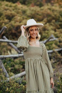 Looking for a unique dress for your fall family photos? Look no further than The Lila Gingham Dress in Olive! This cute midi dress features a flattering square neck and smocked bodice. Perfect for playful family photos! Paired with THE MIMI COWGIRL BOOTS IN WHITE Square neck Smocked bodice Elastic long sleeves Midi length Side pockets 100% cotton Model is 5'9" wearing a small. Fits true to size. Small (0-2), Medium (4-6), Large (8-10). Length (shoulder to hem): Small: 45.5”, Medium: 46.5”, Large Happy Threads, Summer Goddess, Pink Desert, Unique Dress, Exclusive Clothing, Fall Family Photos, White Square, Halloween Sale, Fall Family