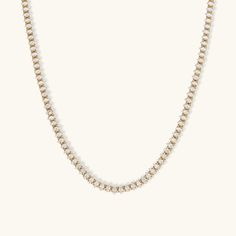 Make a statement of timeless elegance with the Zia Diamond Tennis Necklace. Featuring a stunning array of diamond simulants intricately set in a delicate 18K gold chain, this piece radiates luxury and sophistication. Perfect for layering or standing alone, the Zia necklace is ideal for formal occasions or elevating everyday outfits. Waterproof, hypoallergenic, and ethically sourced, it's designed for both beauty and comfort. Composition:Ethically sourced Stainless Steel-Plated 18k Gold and AAAAA Diamond.Water, Sweat, and Heat Resistant. (No discoloration, No Tarnishing).Hypoallergenic and skin-friendly.Comes in an eco-friendly package.Measurements:Length: 20 Inches Ol Fashion, Diamond Tennis Necklace, 18k Gold Chain, Fashion Office, Standing Alone, Stainless Steel Plate, Diamond Simulant, Tennis Necklace, Office Lady