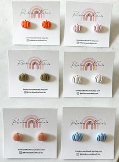 four pairs of earrings are shown in different colors and shapes, each with an individual earring