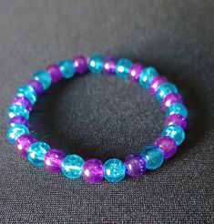 💜 Made with durable, pre-stretched crystal elastic for a perfect fit. 💜 Made with purple and blue 6mm glass beads. 💜 Beautiful in the light. 💜 Slight color variations may occur due to flash used in photography and photo enlargement. 💜 Bracelet will be shipped within 1 to 3 days except holidays. 📬 💜 If you have any questions, please don't hesitate to contact me. I will do my best to reply as soon as possible. Blue And Purple Bracelet, Turquoise Crystal Bracelet With 8mm Beads As Gift, Gift Turquoise Crystal Bracelet With 8mm Beads, Hypoallergenic Blue Beaded Bracelets For Birthday, Hypoallergenic Blue Beaded Bracelets For Birthdays, Blue Round Bead Stretch Bracelet For Birthday, Blue Round Beads Stretch Bracelet For Birthday, Blue Round Beaded Stretch Bracelet For Birthday, Blue Spiritual Stretch Bracelet As Gift