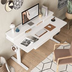 a white desk with a computer monitor and keyboard