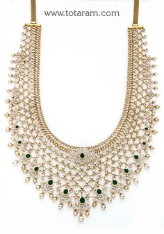 18 karat gold diamond long necklace with color stones & south sea pearls
  this product has inter changeable stones in the necklace and pendant. 

     

introducing our exquisite 18 karat gold diamond long necklace with color stones & south sea pearls, a true masterpiece that combines elegance and craftsmanship. handcrafted in india by totaram jewelers, this necklace is a symbol of luxury and sophistication.
  
  with its interchangeable stones, this necklace offers versatility and allows you t Green Hallmarked Diamond Necklace For Wedding, Hallmarked Green Diamond Necklace For Wedding, Gold Emerald Necklace With Jewels In Fine Jewelry Style, Gold Emerald Necklace With Jewels, Gold Diamond-cut Emerald Necklace, Formal Gold Emerald Necklace With Diamond Cut, Gold Diamond Necklace With Jewels In Fine Jewelry Style, Gold Diamond Necklace With Jewels, Fine Jewelry Gold Diamond Necklace With Jewels