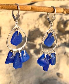 "Top quality cobalt blue sea glass from Puerto Rico are brought to life in a beautiful chandelier earring setting. This design and colors are very desired, and they always sell out when i have them in stock at sea glass festivals. cobalt blue are considered rare colors and it is very hard and time consuming to collect enough sea glass pieces in similar size and shape to create this amazing earrings. Each sea glass piece is carefully hand drilled. They are so much fun and lots of sparkling. One o Blue Sea Glass Nickel Free Earrings, Blue Sea Glass Nickel-free Earrings, Nickel-free Blue Sea Glass Earrings, Handmade Blue Sea Glass Earrings, Blue Recycled Glass Dangle Earrings, Blue Recycled Glass Nickel-free Earrings, Nickel-free Blue Recycled Glass Earrings, Blue Nickel-free Recycled Glass Earrings, Blue Teardrop Sterling Silver Chandelier Earrings