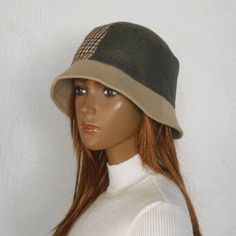 Size 57-58 cm  Women's bucket hat. This is a fashionable and stylish hat for the cold season. Winter hat with small brim. The women's hat is made of checkered fabric and monochrome brown fabric with a slight shiny effect.   Beautiful combination of colors - beige and brown.  Hat with warm lining.  Size 57-58 cm Casual Winter Fedora For Outdoor, Winter Felt Bucket Hat, Trendy Brimmed Bucket Hat For Winter, Trendy Brimmed Winter Bucket Hat, Trendy Wide Brim Winter Bucket Hat, Trendy Brimmed Cloche Hat For Winter, Casual Cloche Hat For Fall, Winter Cloche Hat With Short Brim, Short Brim Bucket Hat For Fall