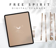 the digital planner is on display next to it's paper and pen, which are also available for purchase