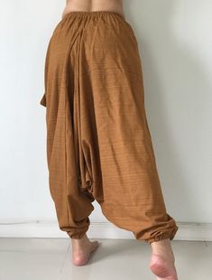 "These super soft rayon baggy unisex harem pants have the \"flow\", perfect of yoga or just a cool strolling. Comfort and character are what these pants are all about. They have the traditional sarong look & feel but a lot more practical when it comes to activity like yoga. As a bonus, they are convertible! Just pull them up and you get yourself a cute jumpsuit in a flash. Together with elastic cuff legs, you can wear them short or long. The pants have smock waist (wide bang elastic) with no Baggy Harem Yoga Pants For Loungewear, Yoga Harem Pants With Elastic Waistband, Relaxed Fit Harem Pants For Meditation, Relaxed Fit Harem Yoga Pants, Baggy Parachute Pants For Yoga, Relaxed Fit Harem Bottoms For Meditation, Meditation Harem Bottoms With Elastic Waistband, Casual Harem Bottoms For Meditation, Casual Baggy Drop Crotch Yoga Pants