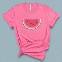 This minimal watermelon graphic t-shirt with its subtle retro feel comes straight from the pages of yesteryear. This wedge of watermelon graphic tee is supper sweet without being sticky. Its a perfect companion for your a pair of jean shorts and a hot summer day. DETAILS This Beautiful graphic t-shirt is made of 49% to 100% combed and ring-spun cotton and is very soft and comfortable to wear. Check the size card for specific fabrications per color. We use DTG technology and eco friendly inks all Watermelon Graphic, Watermelon Shirt, Married Shirt, Watermelon Print, Custom Aprons, Vegan Shirt, Shirts For Teens, Wedding Shirts, Retro Summer