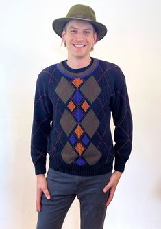 This is a cute 90s vintage menswear cotton argyle sweater by "Gant"! It's heavy and soft, in black with a unique hand intarsia brown, purple and coral argyle design on the front. The entire sweater, front and back, is intersected with windowpane lines of tiny pink hearts. The crew neckline stands out in brown edged with purple, and the long sleeves and hem are finished with ribbed knit in solid black. A sparsely arranged cable knit in the weave gives the sweater an extra hint of texture and chunkiness. Hand intarsia is a traditional knitting technique that gives a clean "inlaid" look when combining colors and is considered a "slow fashion" method of knitting.  It's in good clean condition with light normal wear, no flaws noted. The labels say "Gant, Hand Intarsia, 100% Cotton, L, Made in T Retro Long Sleeve Argyle Sweater, Casual Argyle Pattern Crew Neck Sweater, Black Argyle Pattern Crew Neck Sweater, Black Argyle Crew Neck Sweater, Winter Cotton Argyle Sweater, Casual Cotton Sweater With Argyle Pattern, Cotton Plaid-patterned Winter Sweater, Casual Cotton Argyle Sweater, Retro Argyle Pattern Crew Neck Sweater