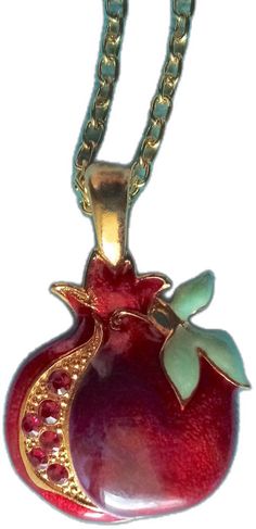 "This necklace has a beautiful pomegranate in a rich red color. it is hand-painted on a gold plated base and measures 1\" tall not counting the gold loop.  with the loop it s 1 1/4\" tall.  the width is 7/8\" wide.  there are three pearlized leaves  and along the left side there are six red swarovski crystals along the other side. the chain is gold filled." Pomegranate Necklace, The Loop, Pomegranate, Red Color, Pendant Necklaces, Necklace Etsy, Swarovski Crystals, Gold Filled, Gold Plate