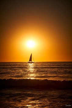 Dark orange sunset over the ocean with the silhouette of a sailboat Waves At Sunset, Boat Sunset Aesthetic, Sunset On A Boat, Sailboat Sunset, I Love The Ocean, Sunset Sailing, Gods Art, Boat Sailing, Richard Chamberlain