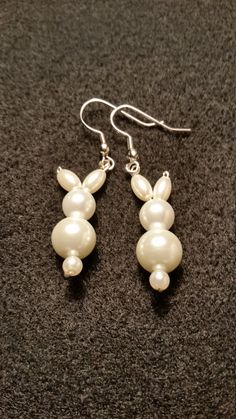 These sweet little bunny rabbit earrings are made out of glass pearl beads. They are perfect for Easter gifts for yourself and your friends or for anyone that just loves bunnies! These would make a unique addition to anyone's jewelry collection and make great gifts for friends and family! Cheap Handmade Earrings For Gifting, Cheap Cute Beaded Earrings For Gifts, Cheap Novelty Beaded Earrings As Gift, Cheap Novelty Beaded Earrings For Gift, Cute Cheap Beaded Earrings For Gifts, Cheap Fun Beaded Earrings For Gifts, Affordable Cute Beaded Earrings For Gifts, Cheap Easter Jewelry Gift, Fun Holidays