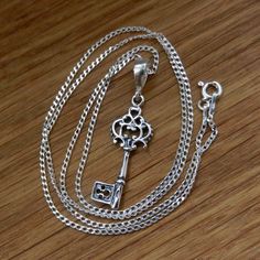 "Sterling Silver necklace with KEY pendant. Curb Chain 1.4mm . Select Length CHAIN. Nickel free. Very good quality, hallmarked 925, made in EU.  Select Length.: - 15.74'' (40cm) - 17.5\" (45cm) - 20'' (50cm) - 21.65'' (55cm) - 24'' (60cm) Clasp: Spring Ring Size: 1.4mm Pendant: 38mm Size key: 30mm x 10mm EARRINGS  for set available here: https://www.etsy.com/listing/784007837/sterling-silver-hoop-earrings-key-elf?ref=shop_home_active_1&frs=1" Key Ornament, Rose Gold Chain Necklace, Crystal Spikes, Romantic Necklace, Key Pendant Necklace, Silver Key, Gold Chain With Pendant, Valentines Necklace, Sterling Silver Hoop Earrings