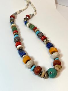 Multi Color & Texture Red Blue Green - Turquoise Bone Agate Coral Stone Clay Bead Necklace - Santa Fe / Southwest Chic OOAK Bone, Shell, Coral, Lapis Lazuli, African Turquoise, Amber Agate, Vein Agate, Coral, Jasper, Mixed Metals and more. Measures approximately 24 inches Lobster closure Boho, Southwest, Santa Fe Chic, Country Chic, Global World, African, Cowgirl, Ethnic, Earthly Natural Luxury Necklace Multicolor Large Beads Southwestern Jewelry, Colorful Bohemian Beads, Gems, And Cabochons, Bohemian Colorful Round Beads, Gems, And Cabochons, Unique Multicolor Beaded Turquoise Necklace, Unique Multicolor Turquoise Necklace With Colorful Beads, Multicolor Polished Beads Southwestern Necklace, Multicolor Polished Southwestern Beads, Multicolor Southwestern Polished Beads, Southwestern Multicolor Polished Beaded Necklaces