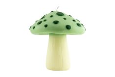 a green mushroom with black dots on it