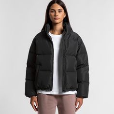 The Women's Puffer Jacket, a relaxed-fit essential crafted from heavy weight 100% recycled polyester with an 80% down 20% feather fill. Features include a stand collar, YKK zip, and water-resistant construction. Perfect for warmth and sustainability, with 630 Fill Power RDS certified down.  Care Instructions Hand wash only. Do not tumble dry. Do not dry clean. Do not iron. Line dry. Recycled Polyester Puffer Outerwear, Cold Weather Solid Color Puffer Jacket In Recycled Polyester, Functional Recycled Polyester Puffer Jacket For Winter, Functional Recycled Polyester Puffer Outerwear, Casual Winter Puffer Jacket In Recycled Polyester, Casual Recycled Polyester Puffer Jacket For Winter, Fall Puffer Jacket In Recycled Polyester, Functional Recycled Polyester Puffer Jacket For Fall, Sporty Recycled Polyester Puffer Jacket For Cold Weather