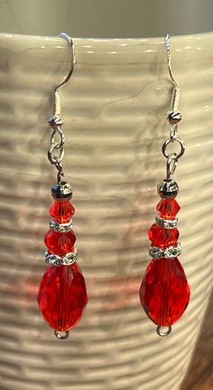 Holiday handmade red sparkling dangle earrings. Red Chandelier Earrings As Gift, Red Handmade Drop Earrings, Red Holiday Earrings With Ear Wire, Holiday Red Ear Wire Earrings, Red Handmade Dangle Crystal Earrings, Red Handmade Crystal Dangle Earrings, Handmade Red Crystal Dangle Earrings, Handmade Red Crystal Drop Earrings, Red Ear Wire Jewelry For Holidays