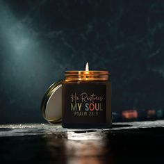 a candle that is on top of a table with the words my soul in it