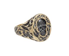 This edgy, hand engraved Castro Smith signet ring has a bold vibe and eye-catching design. The 9K yellow gold band has been carved with bones, skeletons, frogs and leaves. The round ring face has a detailed surface with leaves, spiders, bones and one large skull at its center. Each engraved part has been plated in black rhodium. A tiny engraved flower sits on the inside of the band for a secret for only the wearer. ring face : 3/4" x 5/8"9K yellow gold and black rhodium plated band width : 5mmsize available : 10please contact us for sizing options Luxury Engraved Symbolic Skull Ring, Vintage Gold Engraved Skull Ring, Collectible Engraved Skull-shaped Rings, Luxury Unique Gold Skull Ring, Luxury Gold Skull Ring In Sterling Silver, Alice Cicolini, Digby And Iona, Daniela Villegas, Rebecca Overmann