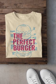 Keywords: UNISEX Vintage Perfect Burger T-Shirt, Food Hoodie, Funny Meme Sweater, Aesthetic Foodie Tee, BBQ Dad Top, Trendy Shirt, Gift For Burger Lover, Graphic Tee  ------------------------------------------------ QUALITY This T-shirt is a UNISEX t-shirt with a vintage illustration and it feels soft and light, with just the right amount of stretch. It features a crew neck, pre-shrunk fabric and side-seamed fit. FIND YOUR SIZE Please find the fitting guide in the pictures to determine your size Tshirt Illustration Design, Food Shirts Graphic Tees, Company Shirt Design, Retro T Shirt Designs, Graphic Tee Ideas, Food Shirt Design, Stamp Shirt, Pizza T Shirt