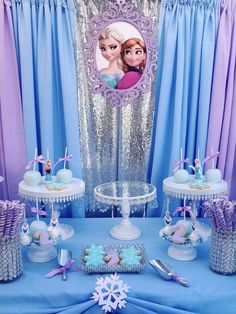 a frozen princess birthday party with blue and purple decorations