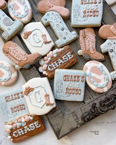 some decorated cookies are sitting on a table