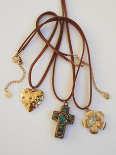 Add some vintage flair to your look with the Neva Cross Necklace. Featuring a trendy brown cord and a beautifully detailed turquoise cross pendant ♱ 18KT Gold Filled ♱ Length: 15” + 2” Extender ♱ Non-tarnish ♱ Hypoallergenic♱ Delicately Handmade Vintage Adjustable Cross Pendant Necklace, Adjustable Vintage Cross Pendant Necklace, Vintage Brown Jewelry With Adjustable Cord, Adjustable Brown Cross Pendant Necklace, Brown Bohemian Cross Necklace, Bohemian Brown Cross Necklace, Adjustable Brown Cross Necklace, Turquoise Cross Pendant, Turquoise Cross