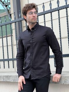 We're Featuring a Special Production of high-quality slim-fit Cotton Black Shirt From HolloMen Spring Summer New Collection. Shirt Color: Black. Shirts Fabric includes 100% Cotton. Product Details: Cotton and Button Collar. Do not machine wash. Dry clean only. Our model wears size Medium (M); his height and weight are 185cm and 78kg, respectively. Be sure to type in your height and weight for size confirmation. Classic Black Button-up Shirt, Black Relaxed Fit Formal Top, Black Relaxed Fit Top For Formal Occasions, Black Relaxed Fit Button-up Shirt, Relaxed Fit Black Business Shirt, Black Relaxed Fit Shirt For Business, Black Slim Fit Top With Spread Collar, Black Slim Fit Top For Semi-formal Occasions, Formal Black Relaxed Fit Shirt