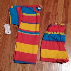 Vintage Palmetto's Bright Striped Tee & Shorts Matching Set. New With Tags. Size Small Youth. Add A Pop Of Color To Your Wardrobe With This Fun And Vibrant Set: - Eye-Catching Striped Pattern In Red, Blue, And Yellow - Ripped Detail On The Shorts Adds A Casual, Edgy Touch - High-Waisted Style For Comfort And On-Trend Look Keywords: Striped, Colorful, High-Waisted, Ripped Detail, Casual Shorts #Colorfulshorts #Stripedshorts #Highwaistedshorts #Summerfashion #Casualwear New To Poshmark? Sign Up Wi Multicolor Short Sleeve Color Block Set, Retro Multicolor Summer Sets, Summer Color Block Short Sleeve Sets, Multicolor Cotton Color Block Sets, Multicolor Cotton Sets With Color Block, Multicolor Summer Bottoms For Playwear, Multicolor Summer Playwear Bottoms, Multicolor Bottoms For Summer Playtime, Summer Multicolor Bottoms For Playwear