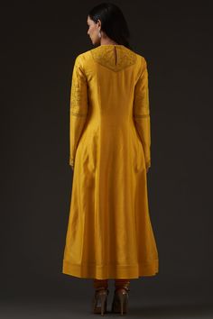 Editor's Note Chanderi Embroidered Kalidar Kurta Paired With Crinkled Chanderi Dupatta & Churidar Color: Yellow Fabric: Chanderi, Cotton Care: Dry Clean Only About the Designer Rohit Bal is intensely concerned with design as an art form. The designer draws on history, fantasy and folklore to create masterpieces that are desired by discerning aficionados around the globe. Rohit has a deep understanding of the psyche of the fashion world and it reflects in his collections that are intelligent, stu Long Semi-stitched Embroidered Salwar Kameez, Designer Yellow Churidar With Intricate Embroidery, Traditional Cotton Silk Dress With Drape, Fitted Sharara With Resham Embroidery For Transitional Season, Semi-stitched Chanderi Sherwani With Cutdana, Designer Embroidered Fitted Salwar Kameez, Gold Embroidered Sharara In Slub Silk, Designer Fitted Embroidered Salwar Kameez, Gold Embroidered Slub Silk Sharara