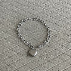 We love stainless steel jewelry! It can look sleek, punky and also lend itself to a hippyish aesthetic. ▪️▪️▪️PRODUCT Women Solid Heart Charm Cable Chain Bracelet Size 19cm Length (adjustable) 316L surgical stainless steel  Never Fade and Hypoallergenic Care instructions: avoid contact with liquids (water, perfume, beauty products) wipe dry with a soft cloth. VISIT STORE FOR MORE PRODUCT 🔗 https://www.etsy.com/ca/shop/TWISTEEL ▪️▪️▪️ S H I P P I N G   All orders will be shipped on the next business day UNITED STATES  - USPS First-Class Mail * 4 - 14 Business Days  Tracking & Insurance included CANADA - Canada Post * 4 - 14 Business Days Tracking & Insurance included EUROPE * 6 - 14 Business Days Tracking & Insurance included AUSTRALIA & ASIA  * 6 - 21 Business Days Tracking & Insurance in Kpop Earrings, Water Perfume, Silver Nose Ring, Funky Jewelry, Minimalist Bracelet, Cross Bracelet, Heart Bracelet, Steel Jewelry, Stainless Steel Jewelry