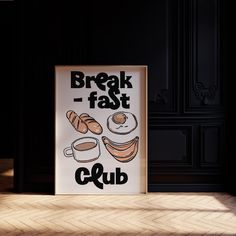 a poster that is on the ground in front of a wall with words breakfast club