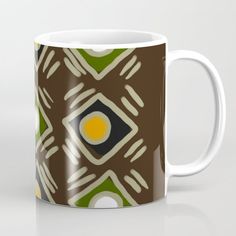 a coffee mug with an abstract design on it