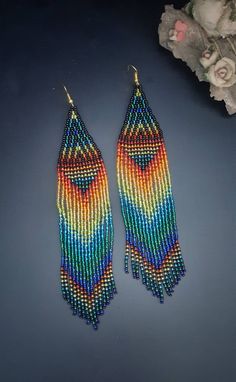 Multicolor Long Drop Fringe Earrings, Rainbow Fringe Dangle Earrings, Rainbow Dangle Earrings With Fringe, Multicolor Beaded Fringe Earrings For Party, Multicolor Fringe Chandelier Earrings For Gift, Multicolor Beaded Tassel Earrings For Party, Bohemian Rainbow Beaded Earrings With Fringe, Bohemian Multicolor Long Drop Beaded Earrings, Bohemian Multicolor Long Drop Tassel Earrings