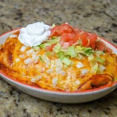 a bowl filled with food sitting on top of a counter