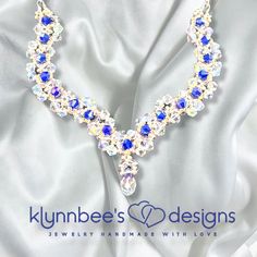 This hand-beaded crystal necklace features a sculpted design to make a beautiful statement on your wedding day or for any special occasion.  It features clear crystals weaved with navy blue crystals in a spectacular design.  This is for the woman who likes to sparkle and shine in all of her fashion styles! Depending on the size, all jewelry comes shipped in either a box with cotton padding or wrapped carefully in tissue paper and mailed in a thick padded envelope to ensure it reaches its destination with no damage.  I am open to all custom orders as well.  Please send me a message and I will work with you to make sure you get exactly what you're looking for! Wedding Crystal Beaded Necklace With Faceted Beads, Crystal Beaded Necklaces With Rhinestones For Wedding, Blue Crystal Necklaces For Wedding, Blue Crystal Necklace For Wedding, Handmade Crystal Necklaces For Wedding, Wedding Jewellery Necklace, Clear Crystals, Cotton Pads, Hand Beading