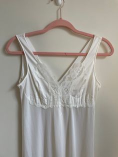 Vintage Perri Ann White Lace Nightgown  White ankle length nightgown with lace trim  Size S Measurements laid flat: Bust - 16.5" Waist - 14.5" Hips - 25" Length - 52" Brand - Perri Ann Fabric Composition - 100% Nylon Made in Canada Vintage items are often more than 20 years old. Being a vintage/ pre-loved  piece, there maybe minor flaws and some pieces may show minor wear and tear. Anything notable will be shown in photos or description. Please check photos and measurements before purchase. If y White Lace Nightgown, Beautiful Nightgown, Lace Nightgown, Women's Nightgowns, Pajama Robe, Nightgowns, 20 Years Old, Ankle Length, Night Gown