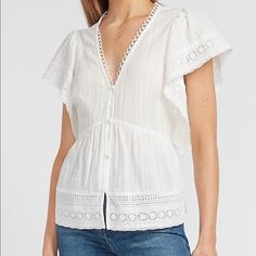 **** **** Express Top With Lace Detail And A Deep V-Neck. It's The Perfect Piece For A Charming Date Night Look Or Shopping Day With Friends. No Longer In Stock At Express.Com This Piece Sold Out Fast. V-Neck Short Ruffle Sleeves Button Front Size Medium Color White Spring V-neck Top For Daywear, Feminine Cotton V-neck Blouse, White V-neck Tops For Daywear, V-neck Tops For Spring Daywear, V-neck Top For Daywear In Spring, Feminine V-neck Cotton Blouse, Fitted V-neck Top For Daywear, Cotton V-neck Tops For Daywear, Chic V-neck Cotton Tops