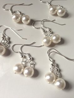 Earrings for my bridesmaids maybe? Silver Drop Pearl Earrings For Bridesmaids, Silver Pearl Drop Earrings For Bridal Shower, Classic Beaded Wedding Earrings, Classic Round Bead Wedding Earrings, White Pearl Jewelry For Bridesmaids, White Pearl Bridesmaid Jewelry, Dangle Pearl Earrings For Bridesmaid Gift, Pearl Dangle Earrings For Bridesmaid Gift, Silver Dangle Pearl Earrings For Bridesmaid