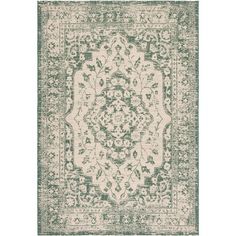 a green and white rug with an ornate design on the bottom, in front of a white background