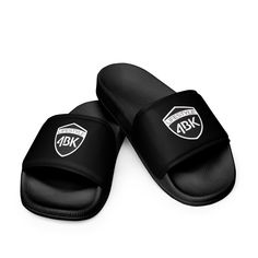 What's a summer without comfy, open-toed shoes? Get yourself these men's slides as an addition to your summery outfits. The cushioned upper strap and textured footbed make these slides an excellent choice for the season's activities. * Cushioned faux leather upper strap * Lightweight polyurethane (PU) outsole * Contoured, textured footbed * Stitched around the upper perimeter for extra durability * Spot clean only * Printed, cut, and handmade * Blank product sourced from China Important: This product is available in the following countries: United States, Canada, Australia, United Kingdom, New Zealand, Japan, Austria, Andorra, Belgium, Bulgaria, Croatia, Czech Republic, Denmark, Estonia, Finland, France, Germany, Greece, Holy See (Vatican city), Hungary, Iceland, Ireland, Italy, Latvia, Li Summer Sports Slides With Round Toe, Non-slip Flip Flops For Sports And Summer, Non-slip Flip Flops For Sports In Summer, Non-slip Sports Flip Flops For Summer, Slip-resistant Open Toe Flip Flops, Adjustable Slip-resistant Open Toe Flip Flops, Summer Sports Slides With Slip-resistant Design, Summer Slip-resistant Slides For Sports, Slip-resistant Open Toe Flip Flops For Swimming