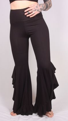 Our Long Ruffle Pants are great for a night out dancing. They are very flattering and recommended for taller women due to the fact that they are longer. These pants are extremely comfortable and fit slightly smaller. I would recommend going up one size. Stretch Fishtail Bottoms For Evening, Evening Stretch Fishtail Bottoms, Elegant Fishtail Bottoms For Evening, Chic Flare Pants With Ruffles, Non-stretch Hip-length Bottoms For Night Out, Non-stretch Leggings For Party, Stretch High Waist Wide Leg Pants For Evening, Glamorous Black Flare Pants, Chic Hip-length Bottoms For Party