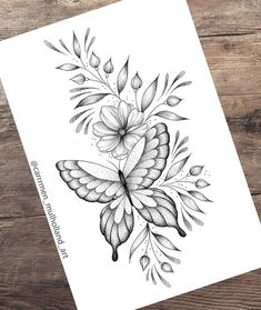 a black and white drawing of a butterfly with flowers on it's back side