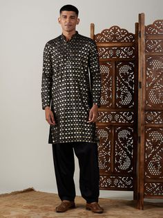 VASTRAMAY Men's Black Foil Printed Kurta With Patiala Set This kurta set by VASTRAMAY combines traditional aesthetics with contemporary design, making it a perfect choice for various occasions. Key Features Black foil printed kurta Comes with a matching Patiala Made from high-quality fabric for comfort Unique and stylish design Specifications Brand: VASTRAMAY Color: Black Print: Foil Print Sizes Available: S, M, L, XL, XXL Material & Care The kurta is made from a blend of cotton and silk, ensuri Patiala For Men, Traditional Black Block Print Kurta, Black Jamawar Kurta With Dupatta, Black Chicken Kurta For Men, Men’s Black Kurta, Foil Print, Black Print, Foil, Quality Fabric